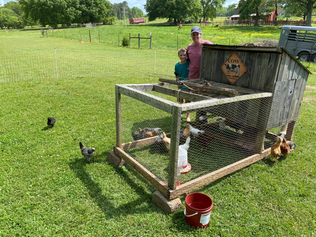 chicken coop on the ranch house farm with brads wife and child