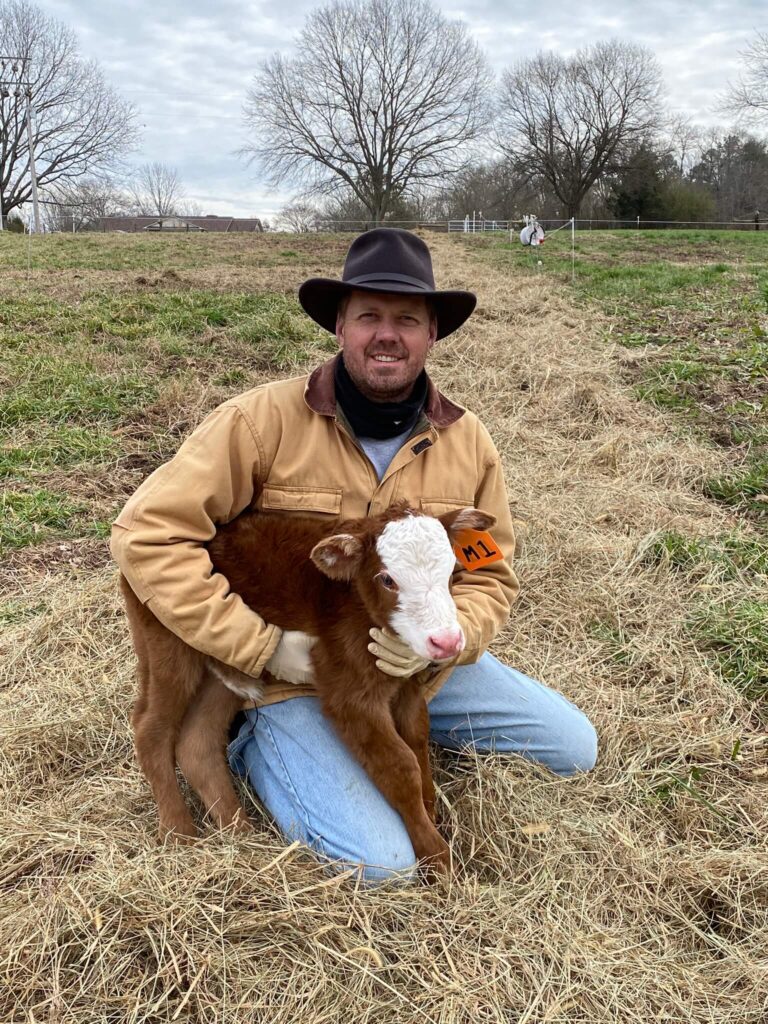 farmer brad with a calf